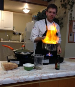 A chef demonstrates mastery of the art of the flambe.