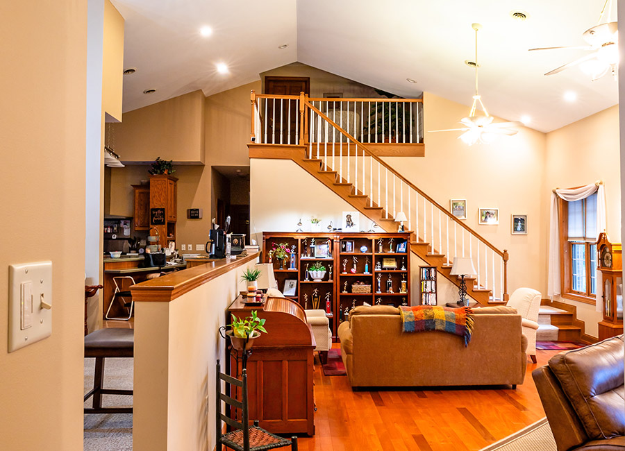 Gathering room view into kitchen and to loft